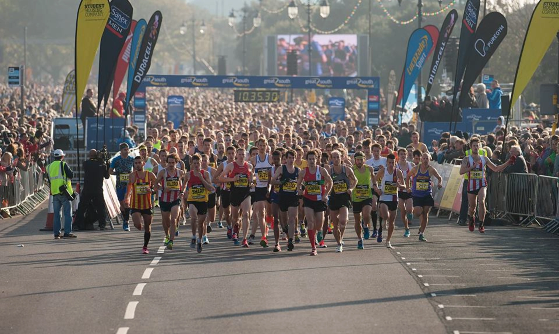 Photo taken at the start of a marathon. Hundreds of runners can be seen stretching into the distance