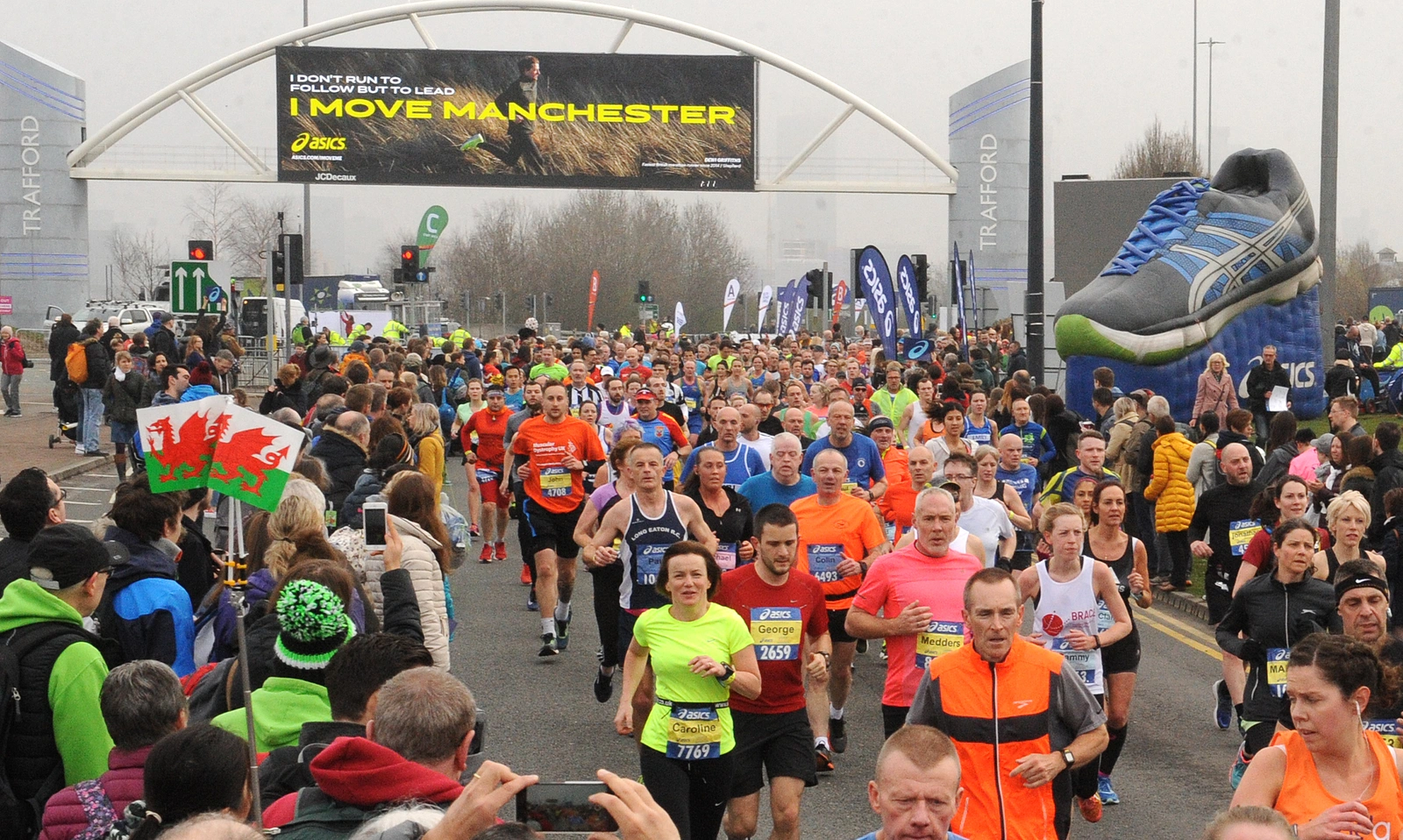 A large group of runners and spectators photographed at the manchester marathon